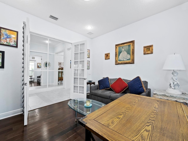 living room featuring hardwood / wood-style floors and french doors