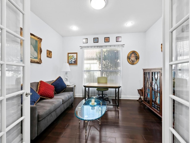 living room featuring french doors and dark hardwood / wood-style flooring