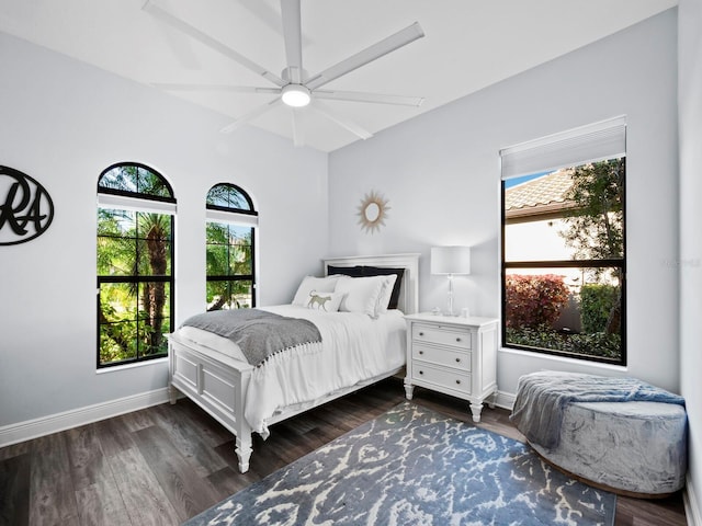 bedroom featuring ceiling fan and dark wood-type flooring