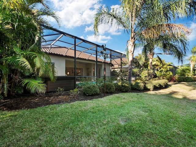 view of yard featuring a lanai