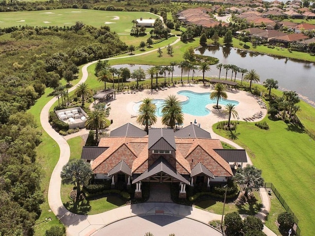 birds eye view of property with a water view