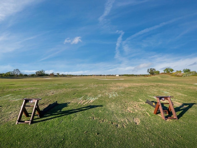 exterior space featuring a lawn and a rural view