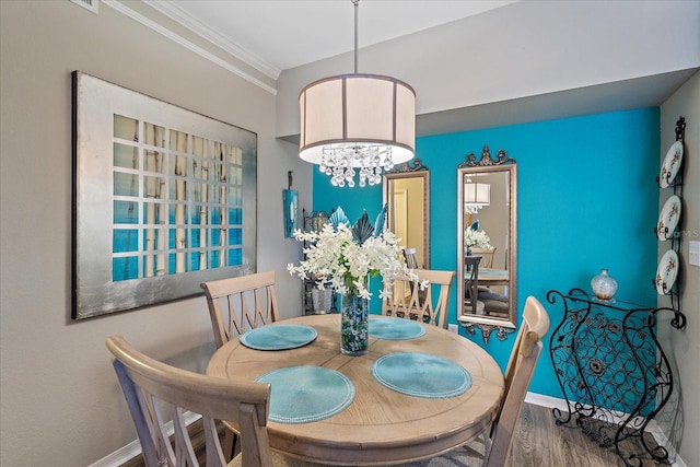 4106 Central Sarasota Pkwy Unit 1026, Sarasota, FL 34238 - dining area with ornamental molding, wood finished floors, and baseboards