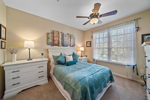 bedroom featuring light carpet and ceiling fan