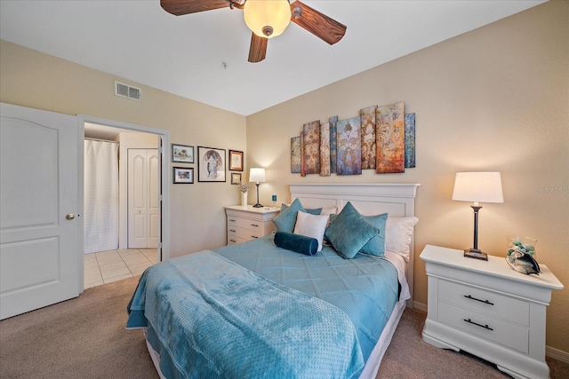 bedroom featuring light carpet and ceiling fan