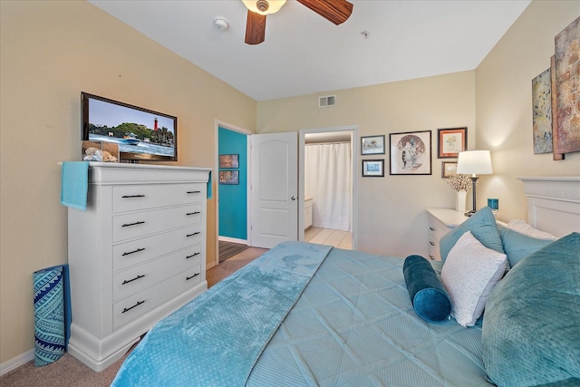 4106 Central Sarasota Pkwy Unit 1026, Sarasota, FL 34238 - bedroom featuring baseboards, ensuite bathroom, a ceiling fan, and light carpet