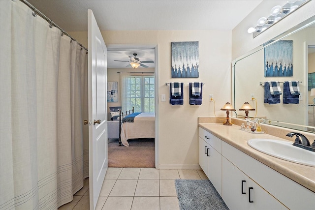 4106 Central Sarasota Pkwy Unit 1026, Sarasota, FL 34238 - full bathroom featuring vanity, ensuite bathroom, tile patterned flooring, ceiling fan, and baseboards