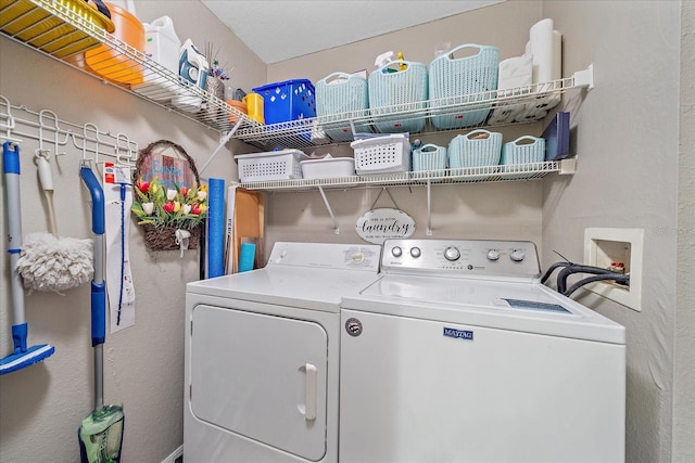 laundry room with washing machine and dryer