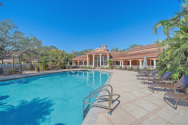 view of pool featuring a patio area