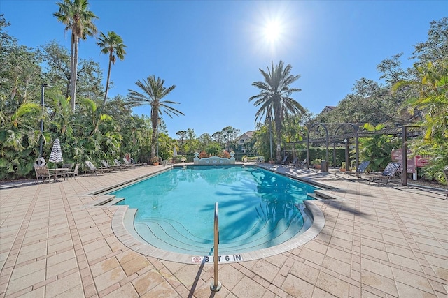 4106 Central Sarasota Pkwy Unit 1026, Sarasota, FL 34238 - community pool with a patio area