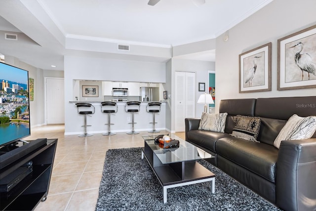 tiled living room with crown molding