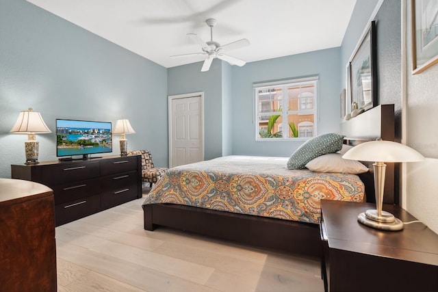 bedroom featuring light hardwood / wood-style floors and ceiling fan