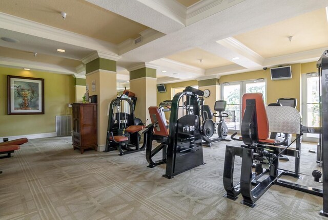 gym with light carpet and crown molding