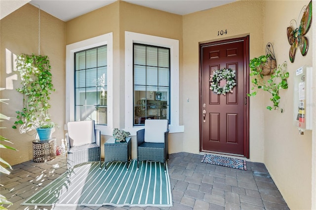 doorway to property with a porch