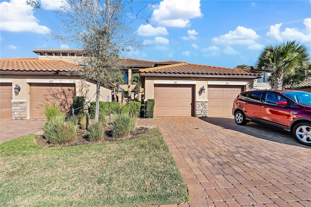 mediterranean / spanish-style home featuring a garage