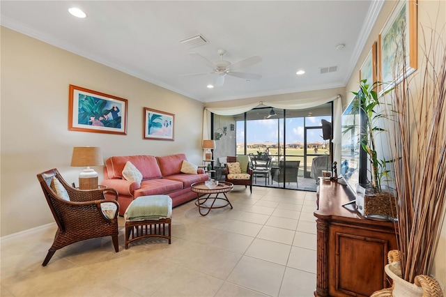 living room featuring ceiling fan, ornamental molding, and light tile patterned floors