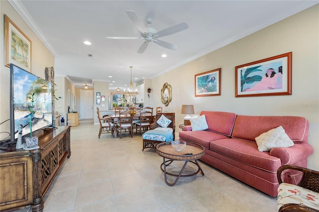 tiled living room with crown molding and ceiling fan with notable chandelier