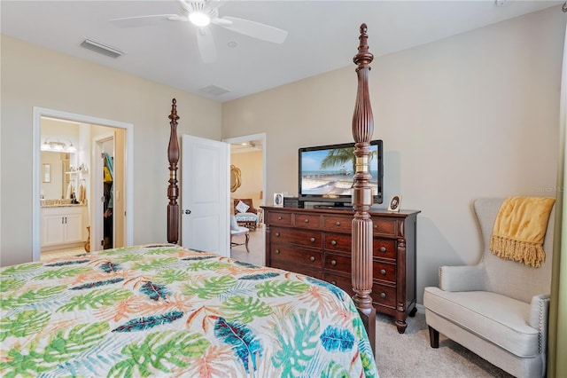 carpeted bedroom featuring ceiling fan and connected bathroom