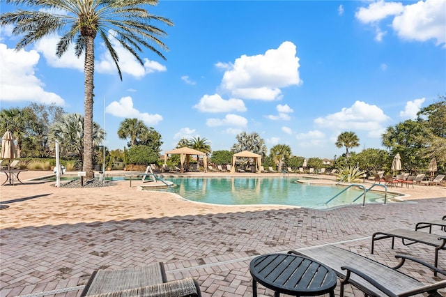 view of swimming pool featuring a gazebo and a patio