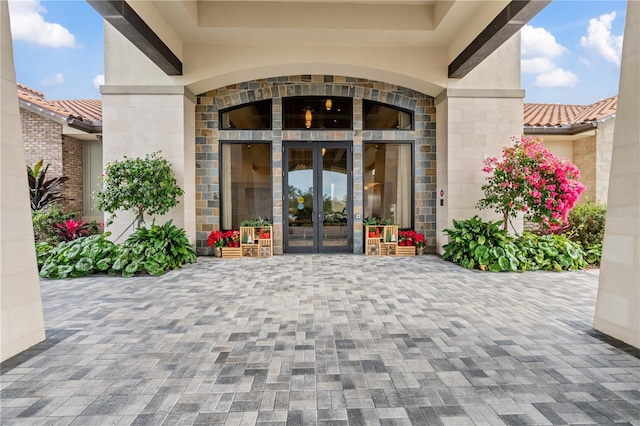 view of exterior entry featuring french doors