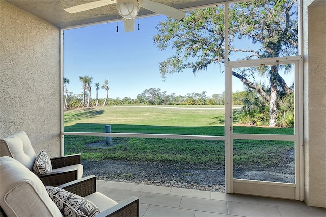 exterior space featuring a wealth of natural light and ceiling fan