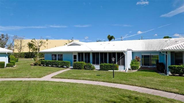 rear view of house with a yard