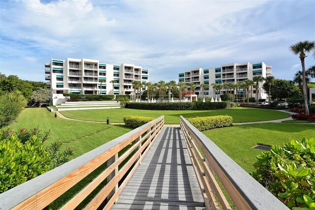 view of home's community featuring a yard