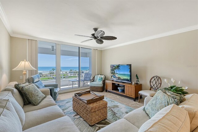 tiled living room with crown molding and ceiling fan