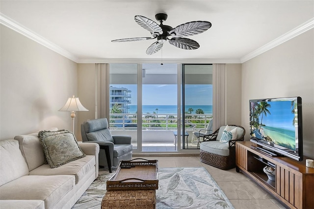 tiled living room featuring expansive windows, ceiling fan, and ornamental molding