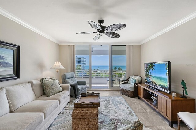 living room with ceiling fan, expansive windows, and ornamental molding