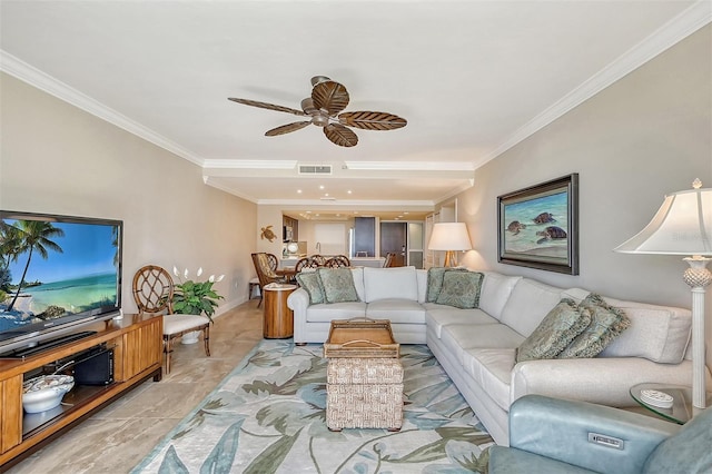 living room with ceiling fan and crown molding