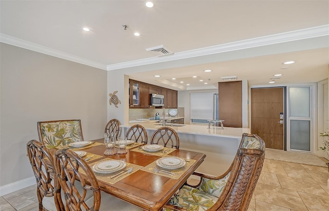 tiled dining space with ornamental molding