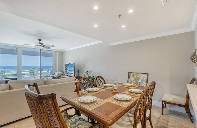 dining room featuring ceiling fan, light tile patterned floors, and crown molding