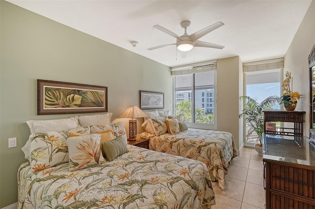 bedroom with light tile patterned floors and ceiling fan