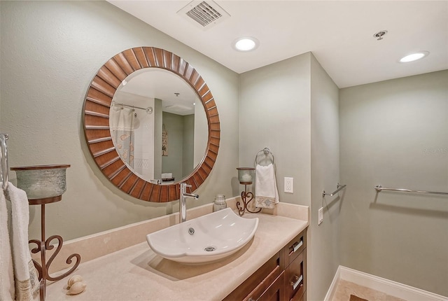 bathroom featuring tile patterned floors and vanity