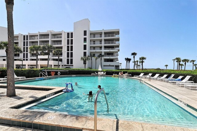 view of pool featuring a patio area