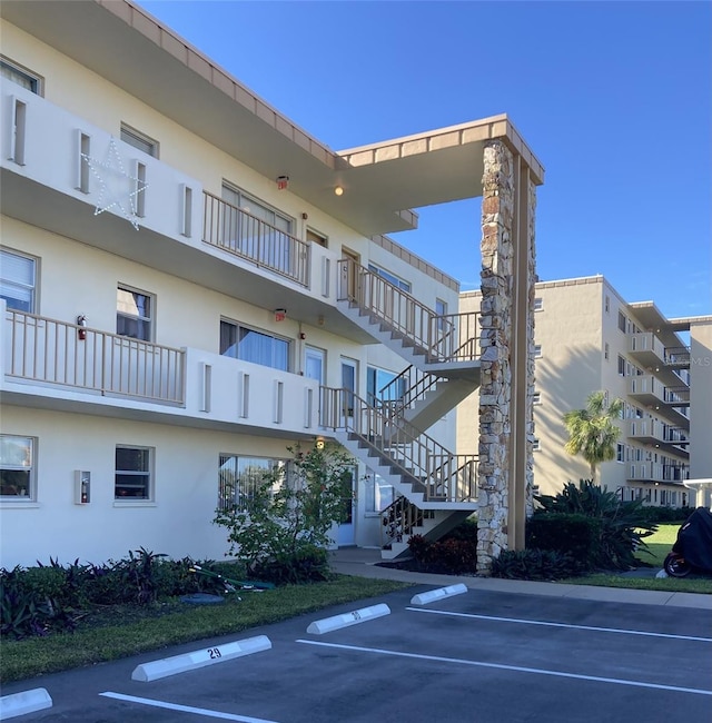 4480 Ironwood Cir Unit 218A, Bradenton, FL 34209 - view of apartment building / complex featuring stairway and uncovered parking