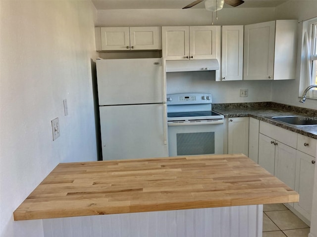 kitchen featuring white cabinets, butcher block counters, white appliances, and sink