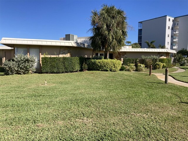 4480 Ironwood Cir Unit 218A, Bradenton, FL 34209 - view of green lawn with central air condition unit