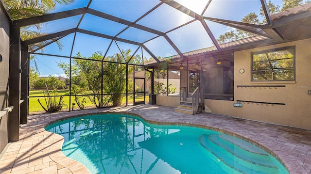 view of pool featuring a lanai and a patio area