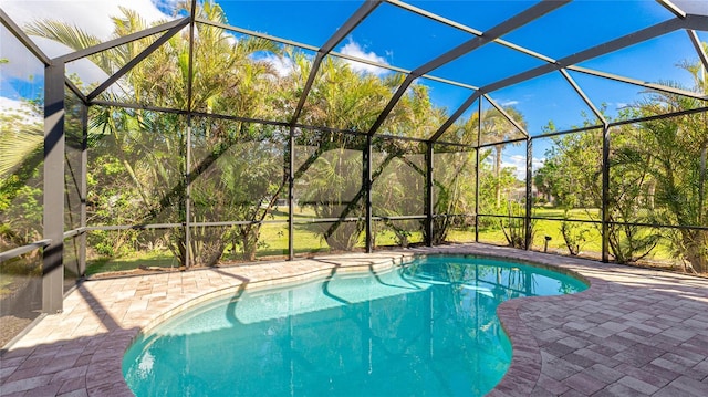 view of pool featuring a lanai and a patio