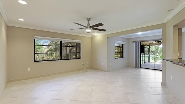 tiled spare room featuring crown molding, plenty of natural light, and ceiling fan