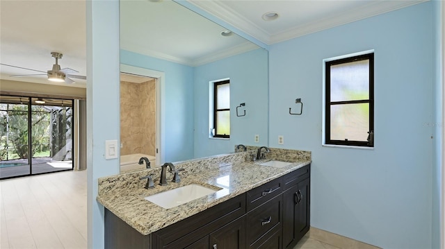 bathroom featuring hardwood / wood-style floors, ceiling fan, crown molding, and vanity