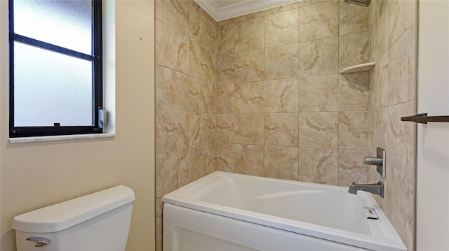 bathroom featuring tiled shower / bath combo and toilet