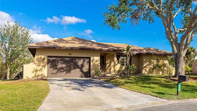 view of front facade featuring a front yard and a garage