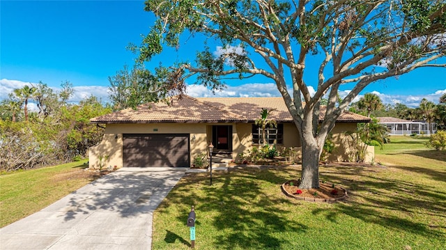 view of front of house with a garage and a front lawn