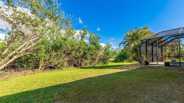 view of yard with a lanai