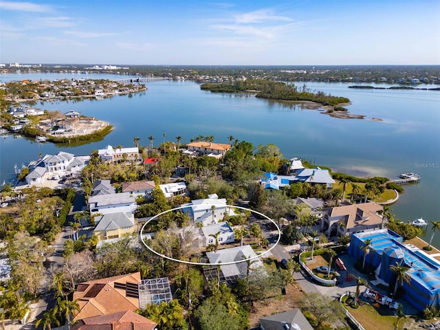 birds eye view of property featuring a water view