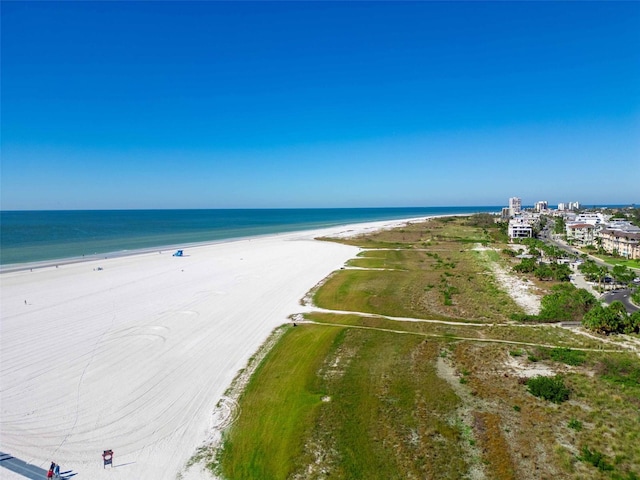 bird's eye view featuring a view of the beach and a water view