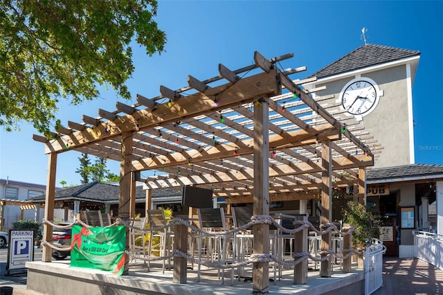 view of home's community featuring a pergola